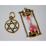 Two 9ct gold charms including a sand timer 2.7g