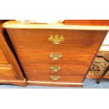 A mahogany chest of drawers with brass fittings