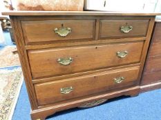 A mahogany chest of drawers with brass fittings