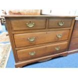 A mahogany chest of drawers with brass fittings