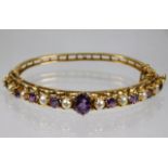 A 9ct gold bangle set with amethyst & pearl 15.9g