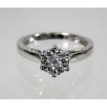 An 18ct white gold diamond ring of floral setting