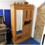 A small satinwood compactum with mirrored door