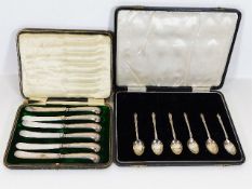 A box containing six silver spoons, lacking other