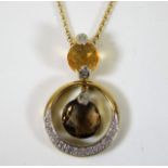 A 9ct gold necklace set with citrine & diamond 4.4