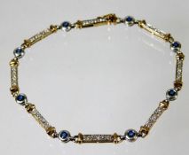 A 9ct gold diamond & sapphire bracelet 7.5in long