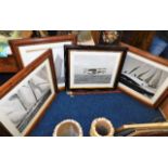 Four photographic prints in quality wooden frames,