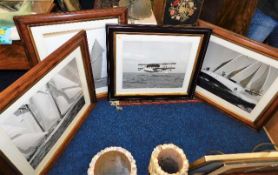 Four photographic prints in quality wooden frames,