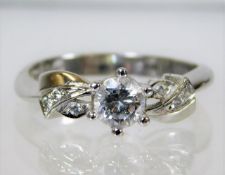 A 14ct white gold ring set with diamond size N/O 2
