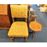 An antique upholstered oak chair twinned with mode