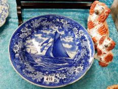 A Wedgwood charger depicting sailship & two Staffordshire dogs