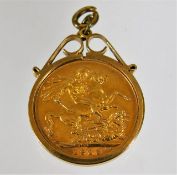 A 9ct gold mounted full gold sovereign 1909
