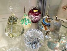 A cut glass crystal paperweight & five other paper
