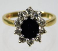 An 18ct gold sapphire & approx. 0.6ct diamond ring