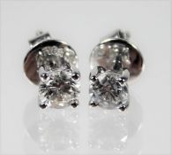 A pair of 18ct white gold earrings set with 0.64ct