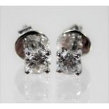 A pair of 18ct white gold earrings set with 0.64ct