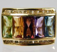 A 9ct gold ring set with diamond, peridot, citrine