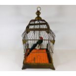 A brass decorative bird cage