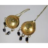 A pair of Egyptian yellow metal earrings 8.9g