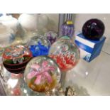 Eight glass paperweights including Caithness