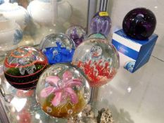 Eight glass paperweights including Caithness