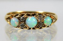 A Victorian 18ct gold ring set with opal & diamond