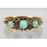 A Victorian 18ct gold ring set with opal & diamond