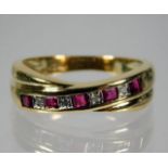 A 9ct gold diamond & ruby crossover ring size L/M
