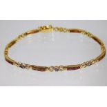 An 18ct gold bracelet set with diamond & ruby 7.4g