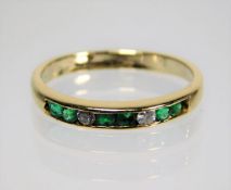 An 18ct gold emerald & diamond ring size L 2.1g