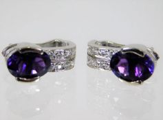 A pair of white gold earrings set with diamonds &
