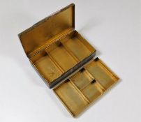 An antique Stokes & Ireland Ltd. hallmarked silver stamp box with two levels, inscribed to top the M
