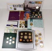 A quantity of coin sets including £5 coins & note