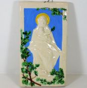 An Italian faience religious plaque of madonna & c