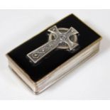 A small silver box with mounted Celtic cross