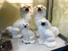 A pair of Staffordshire pottery dogs & two others