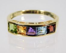 A 9ct gold multi coloured rainbow ring set with pe