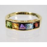 A 9ct gold multi coloured rainbow ring set with pe