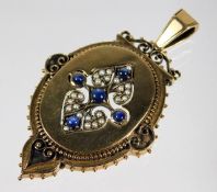 A 9ct gold pendant set with cabochon cut sapphire