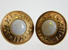 A pair of 9ct gold mounted opal earrings with roma
