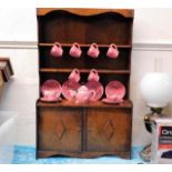 A small scale mahogany dresser with cat design cro