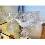 Six cut glass cocktail glasses, one with small cra