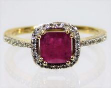 An 18ct gold ring set with ruby & diamond size N 3