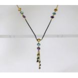 A 14ct gold necklace set with amethyst, citrine &