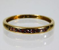 A 9ct gold ring set with orange diamonds size N ap