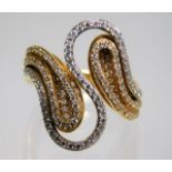 An 18ct two colour gold ring set with diamonds siz