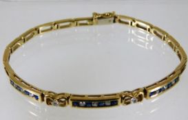 A 9ct gold diamond & sapphire bracelet 10.4g