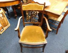 An Edwardian upholstered carver chair