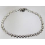 An 18ct white gold bracelet set with 5ct of diamon