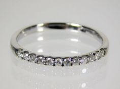 A 9ct white gold ring set with 0.25ct diamonds siz